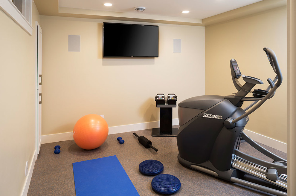 This is an example of a small transitional multipurpose gym in Minneapolis with beige walls.