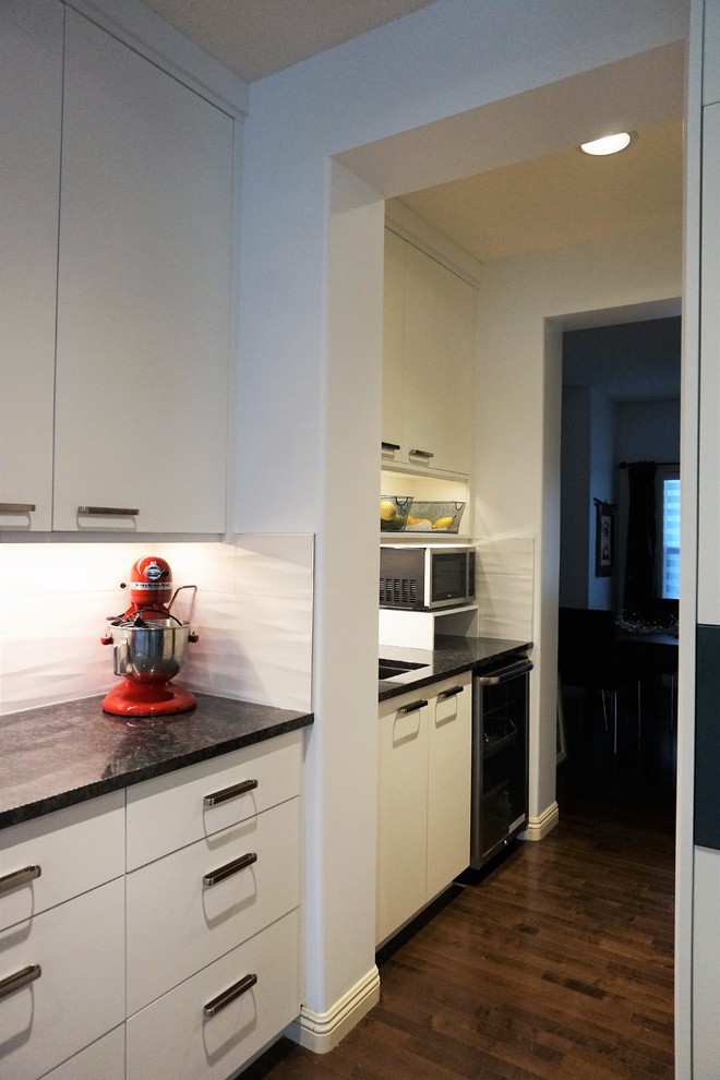 Example of a transitional kitchen design in Calgary