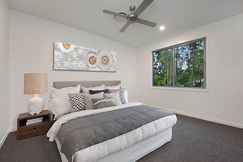 Inspiration for a large modern bedroom in Sunshine Coast with white walls, carpet and grey floor.