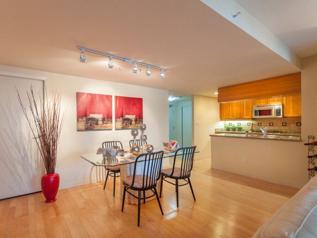 Mid-sized modern open plan dining in Los Angeles with white walls and light hardwood floors.