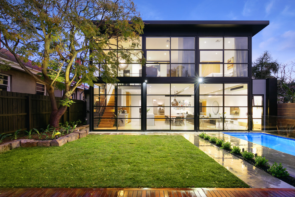 This is an example of a contemporary two-storey glass exterior in Melbourne.