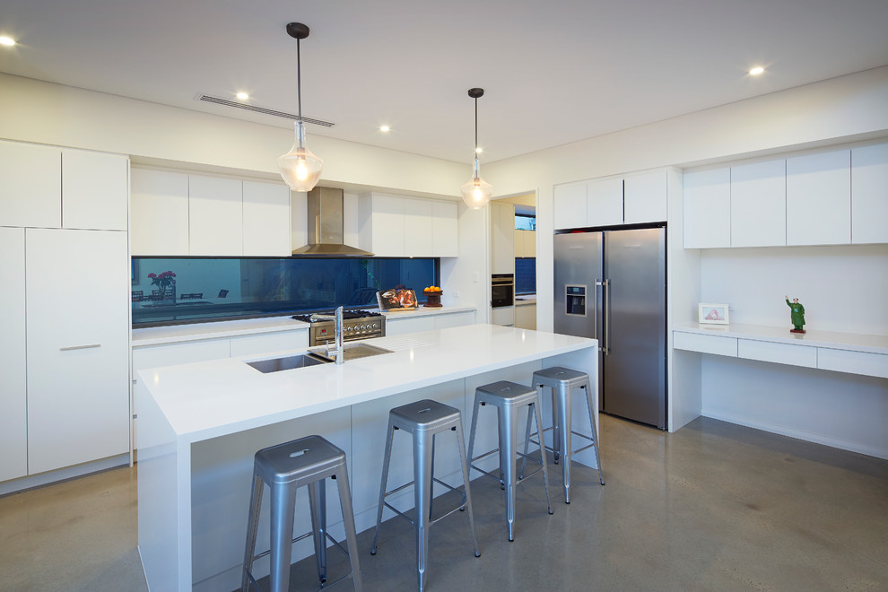 Photo of a contemporary kitchen in Perth with stainless steel appliances, concrete floors and with island.