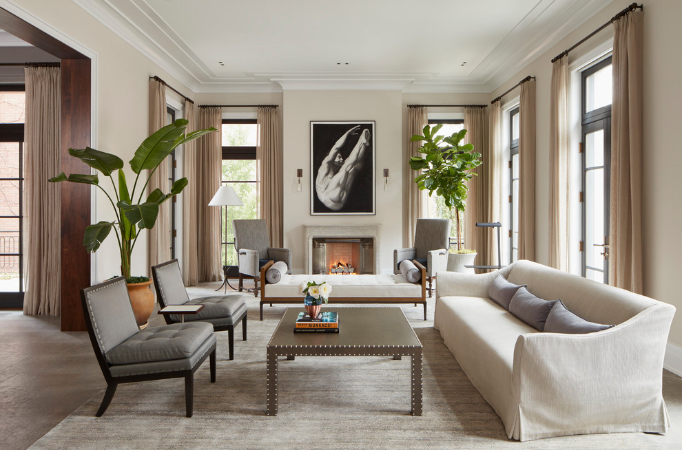 Transitional formal enclosed living room in Chicago with beige walls, carpet, a standard fireplace and grey floor.