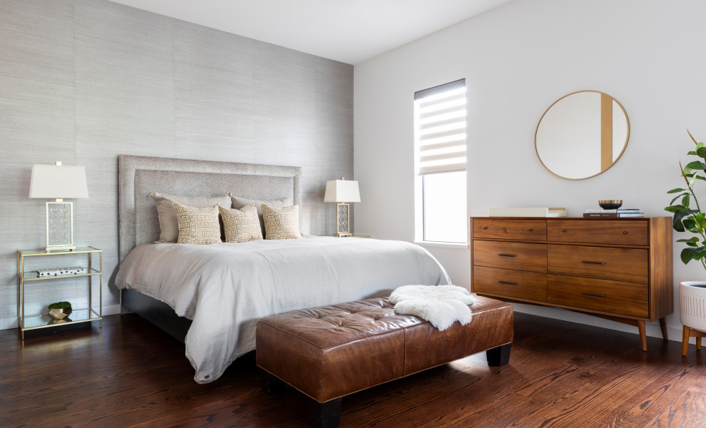 Inspiration for a mid-sized contemporary master bedroom in Houston with white walls, medium hardwood floors, brown floor and wallpaper.