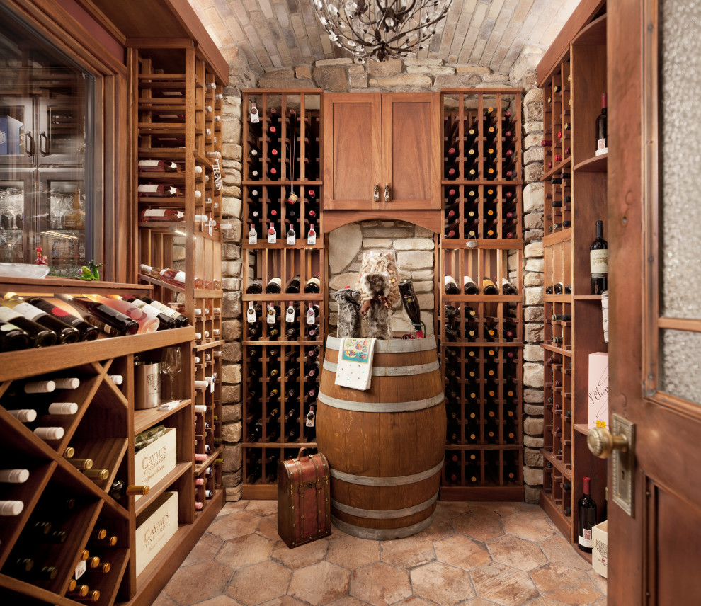 Wine cellar - traditional wine cellar idea in Calgary