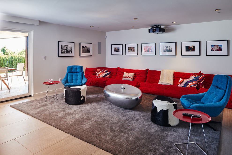 This is an example of a large midcentury enclosed home theatre in Seattle with white walls, porcelain floors and a wall-mounted tv.
