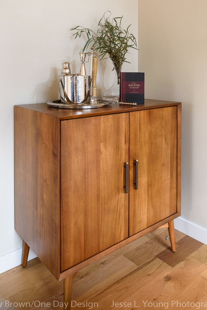 Inspiration for a mid-sized midcentury single-wall bar cart in Seattle with flat-panel cabinets, medium wood cabinets, wood benchtops and medium hardwood floors.
