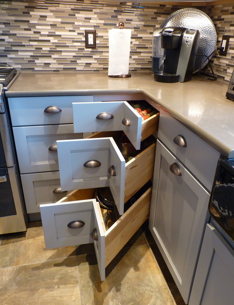 Large transitional u-shaped porcelain tile and beige floor home design photo in Philadelphia with a farmhouse sink, shaker cabinets, gray cabinets, quartz countertops, gray backsplash, mosaic tile backsplash, stainless steel appliances and an island