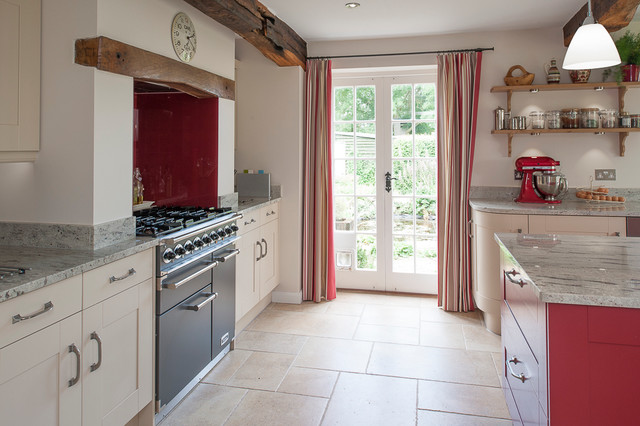 Cottage kitchen accented with red kitchen