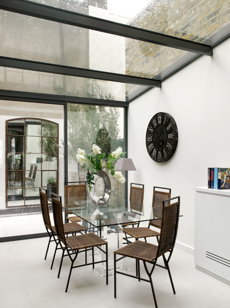 Design ideas for a mid-sized contemporary dining room in London with white walls and porcelain floors.