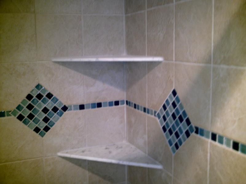 Ceramic tile alcove shower photo in Kansas City with beige walls