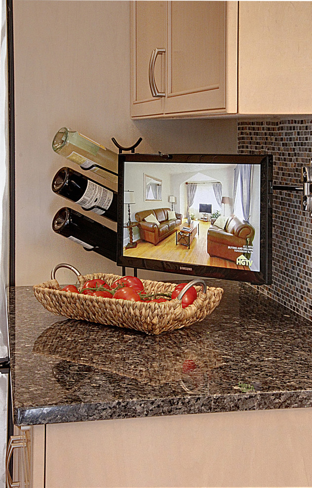 Inspiration for a mid-sized transitional galley ceramic tile home design remodel in New York with an undermount sink, raised-panel cabinets, light wood cabinets, granite countertops, multicolored backsplash, mosaic tile backsplash, stainless steel appliances, gray walls and no island