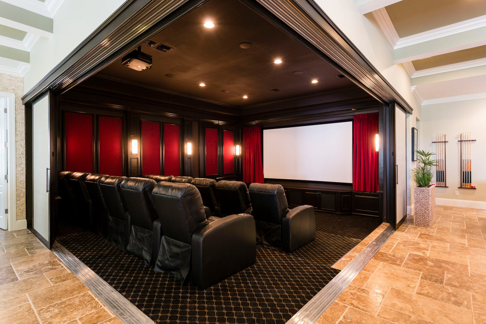 На фото: огромный изолированный домашний кинотеатр в стиле неоклассика (современная классика) с полом из травертина, бежевым полом, черными стенами и телевизором на стене с