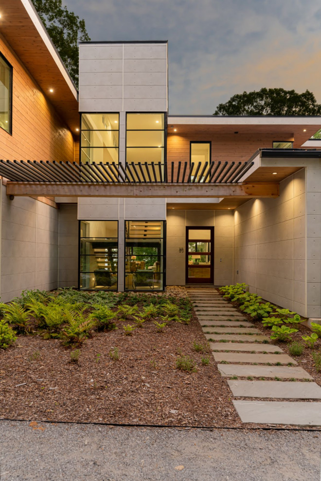 Идея дизайна: двухэтажный, разноцветный частный загородный дом среднего размера в стиле модернизм с комбинированной облицовкой