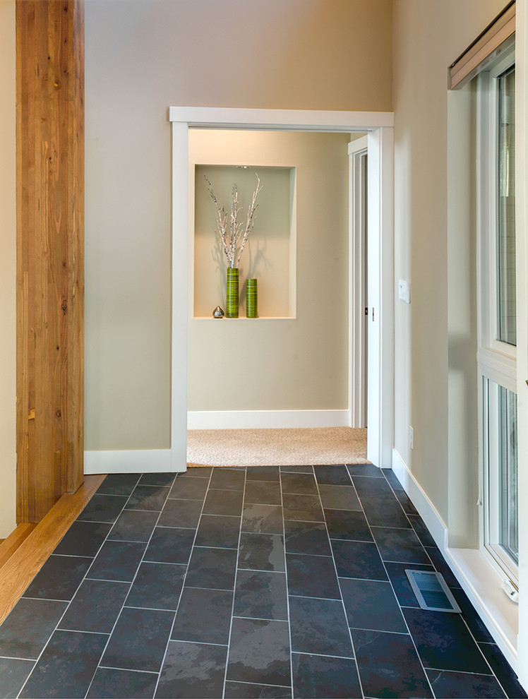 Photo of a contemporary entryway in Seattle with slate floors.
