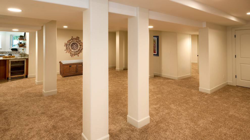 Expansive modern basement in Seattle with white walls and carpet.