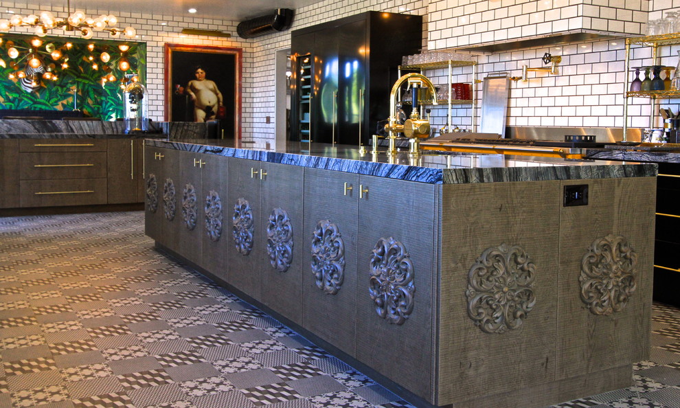 Example of a huge eclectic l-shaped ceramic tile enclosed kitchen design in Orange County with an undermount sink, flat-panel cabinets, gray cabinets, marble countertops, white backsplash, subway tile backsplash, black appliances and an island