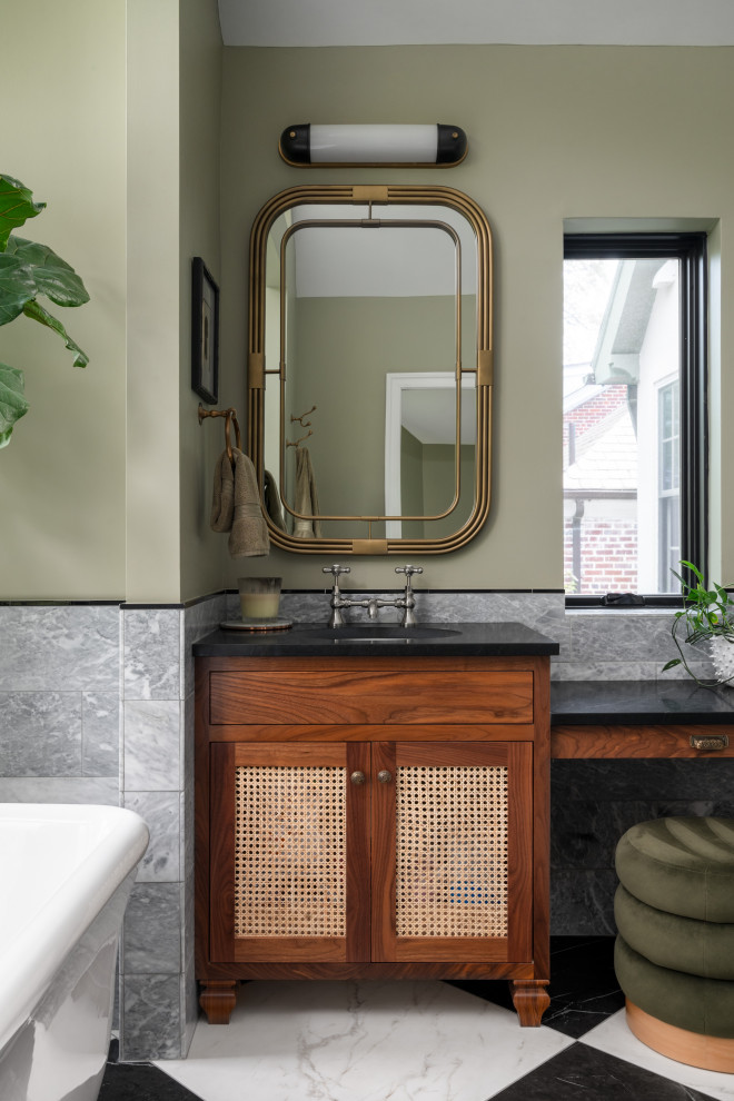 Inspiration for a mid-sized transitional master green tile and marble tile marble floor, double-sink and vaulted ceiling freestanding bathtub remodel in DC Metro with louvered cabinets, medium tone wood cabinets, green walls, an undermount sink, marble countertops, a hinged shower door, black countertops and a built-in vanity