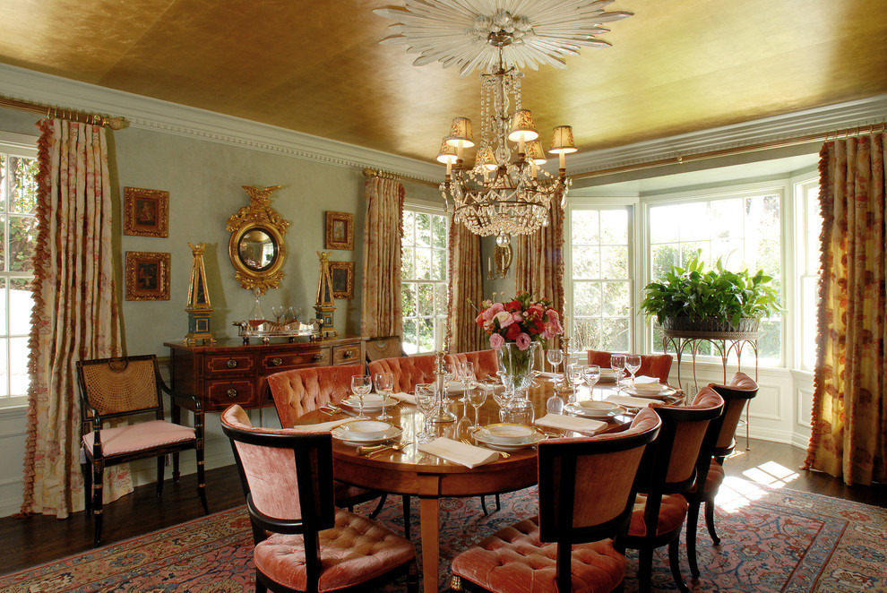 Inspiration for a traditional dining room in Los Angeles with grey walls and dark hardwood floors.