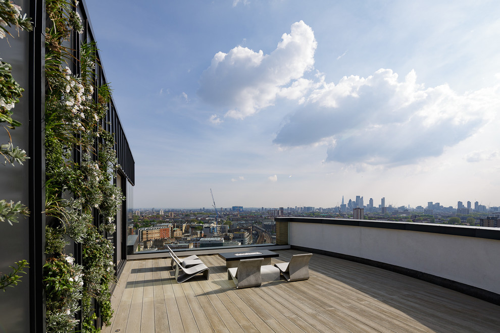 Photo of a large contemporary rooftop and rooftop deck in London with no cover.