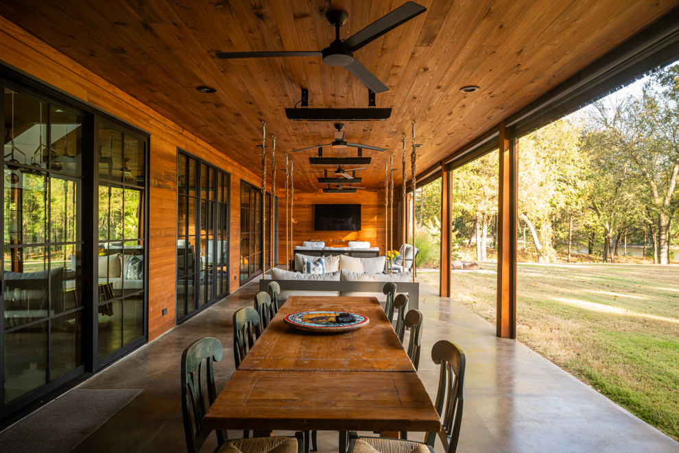 This is an example of a country porch design in Dallas.