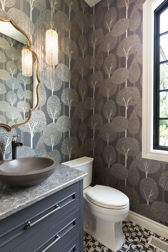 Inspiration for a large mediterranean ceramic tile and multicolored floor powder room remodel in Minneapolis with blue cabinets, a two-piece toilet, a vessel sink, quartz countertops, gray countertops, recessed-panel cabinets and multicolored walls