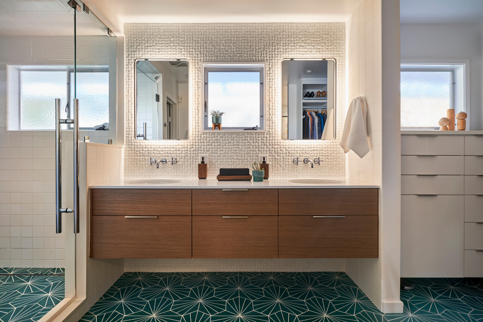 Photo of a mid-sized midcentury master bathroom in San Diego with flat-panel cabinets, medium wood cabinets, an alcove shower, a bidet, white tile, porcelain tile, white walls, cement tiles, an undermount sink, engineered quartz benchtops, turquoise floor, a hinged shower door, white benchtops, an enclosed toilet, a double vanity and a built-in vanity.