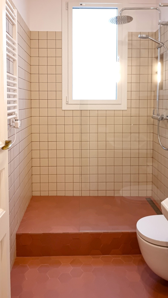 Example of an eclectic master beige tile and ceramic tile terra-cotta tile, red floor and single-sink bathroom design in Other with beige walls, a pedestal sink and a freestanding vanity