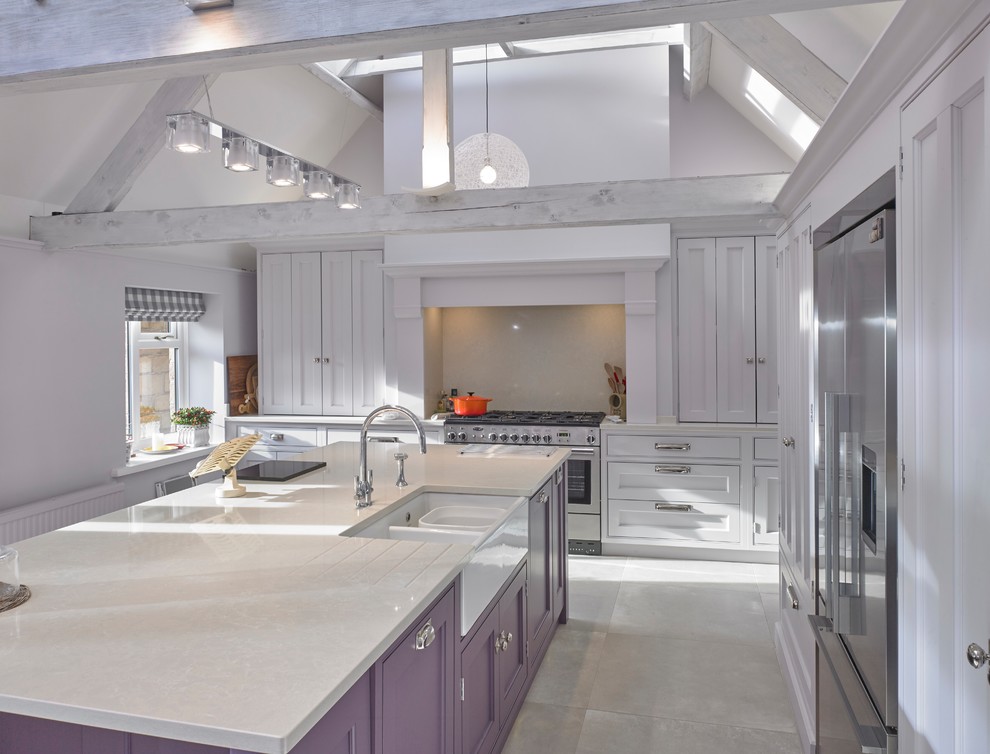 Design ideas for a large traditional single-wall eat-in kitchen in Cheshire with a farmhouse sink, recessed-panel cabinets, purple cabinets, quartzite benchtops, beige splashback, stainless steel appliances, porcelain floors, with island, beige floor and beige benchtop.