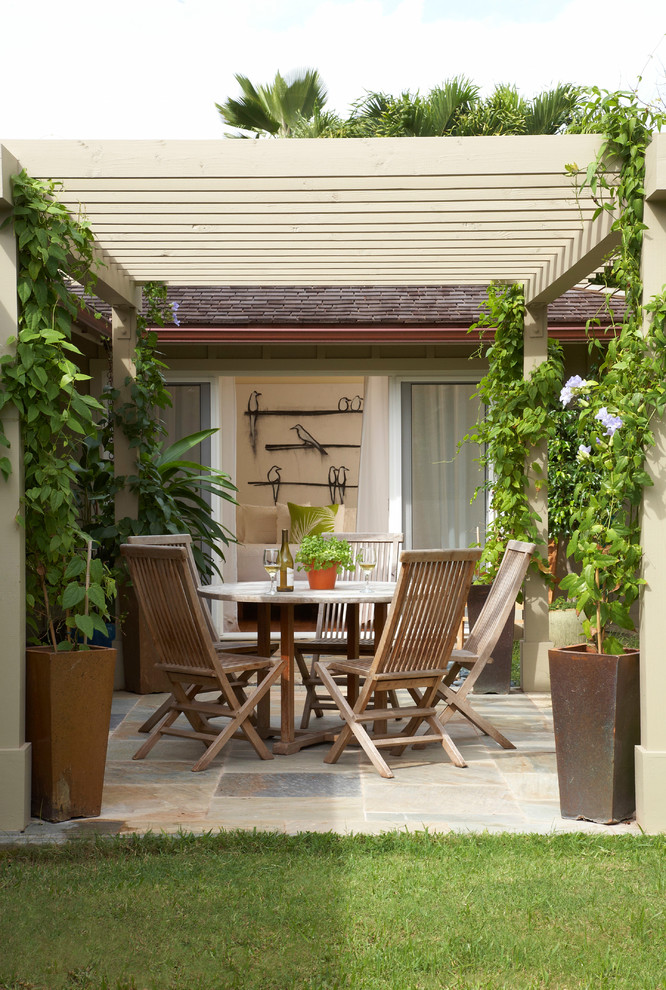 Inspiration for a traditional backyard patio in Hawaii with a pergola.