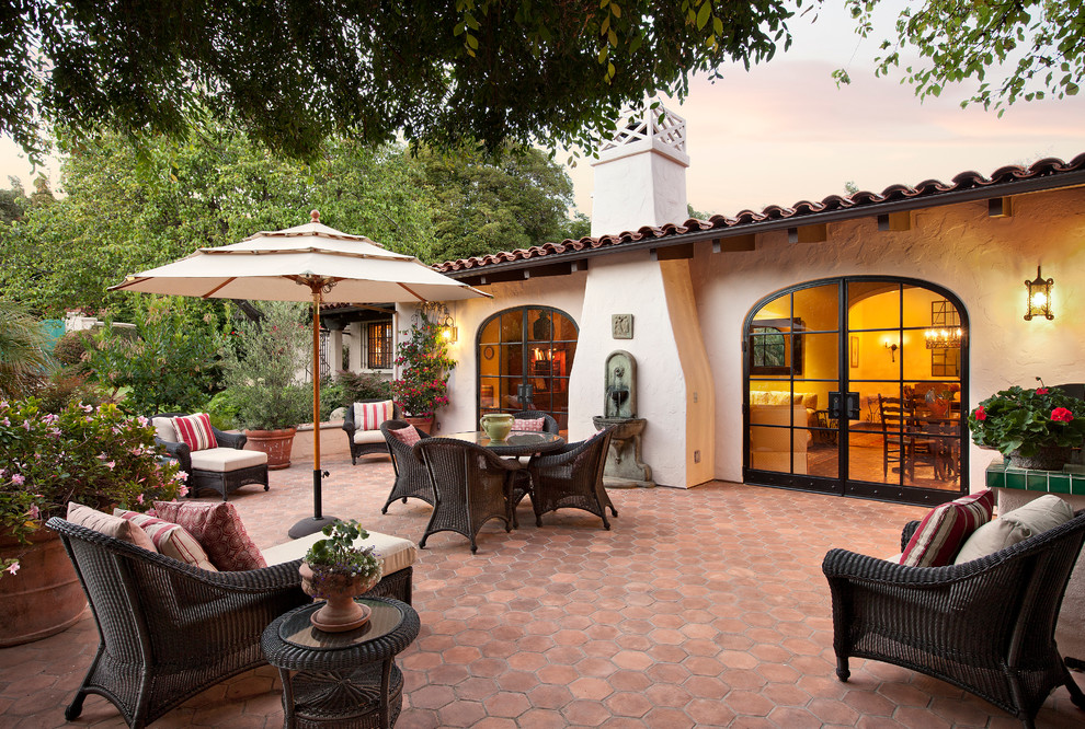 Photo of a mediterranean patio in Santa Barbara with tile and no cover.