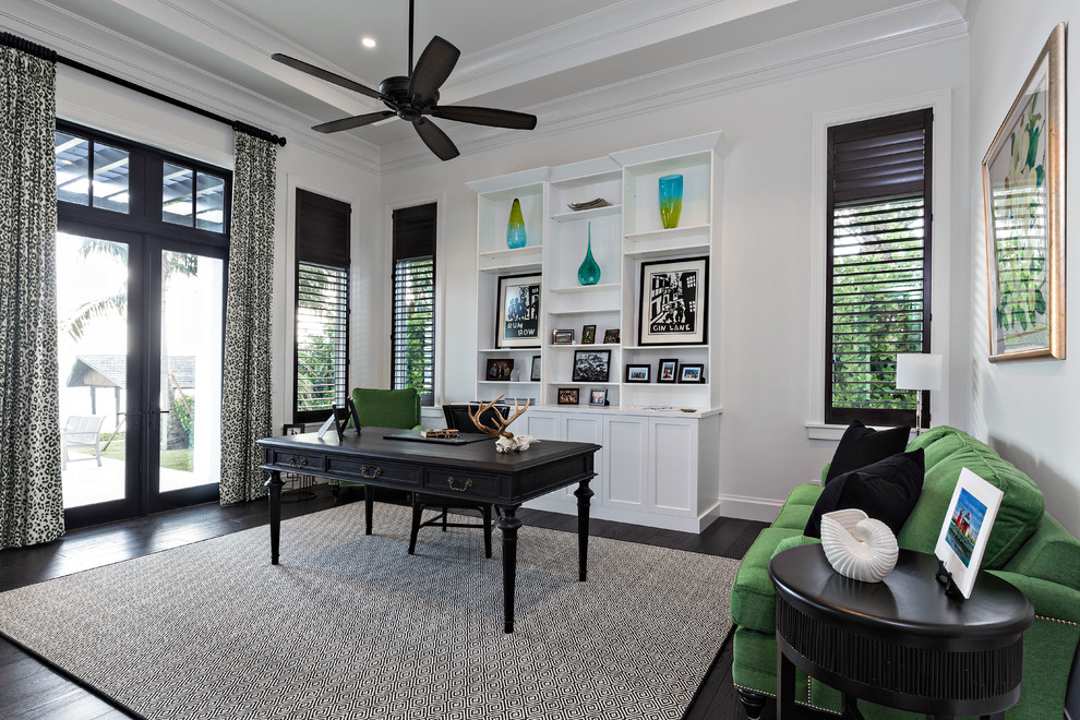 Design ideas for a transitional home office in Miami with white walls, dark hardwood floors and a freestanding desk.