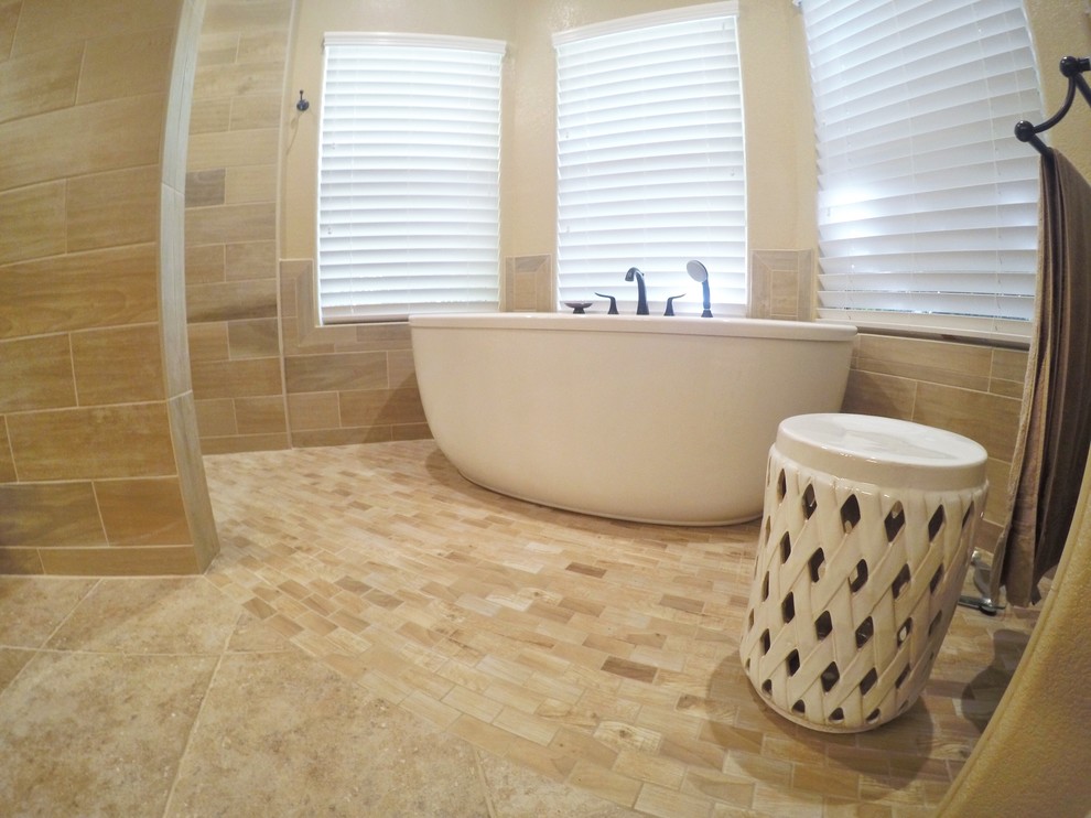 Mid-sized contemporary master bathroom in Other with raised-panel cabinets, medium wood cabinets, a freestanding tub, a curbless shower, beige tile, multi-coloured tile, cement tile, beige walls, ceramic floors, an undermount sink, multi-coloured floor and an open shower.