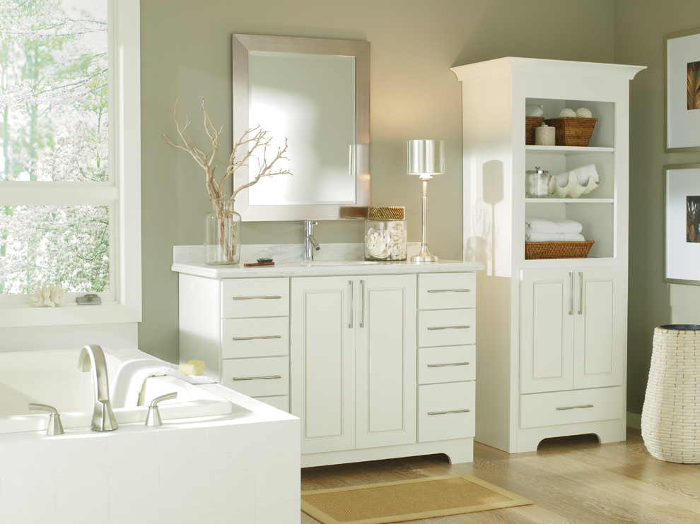 Design ideas for a mid-sized transitional master bathroom in Other with an undermount sink, raised-panel cabinets, white cabinets, green walls and light hardwood floors.