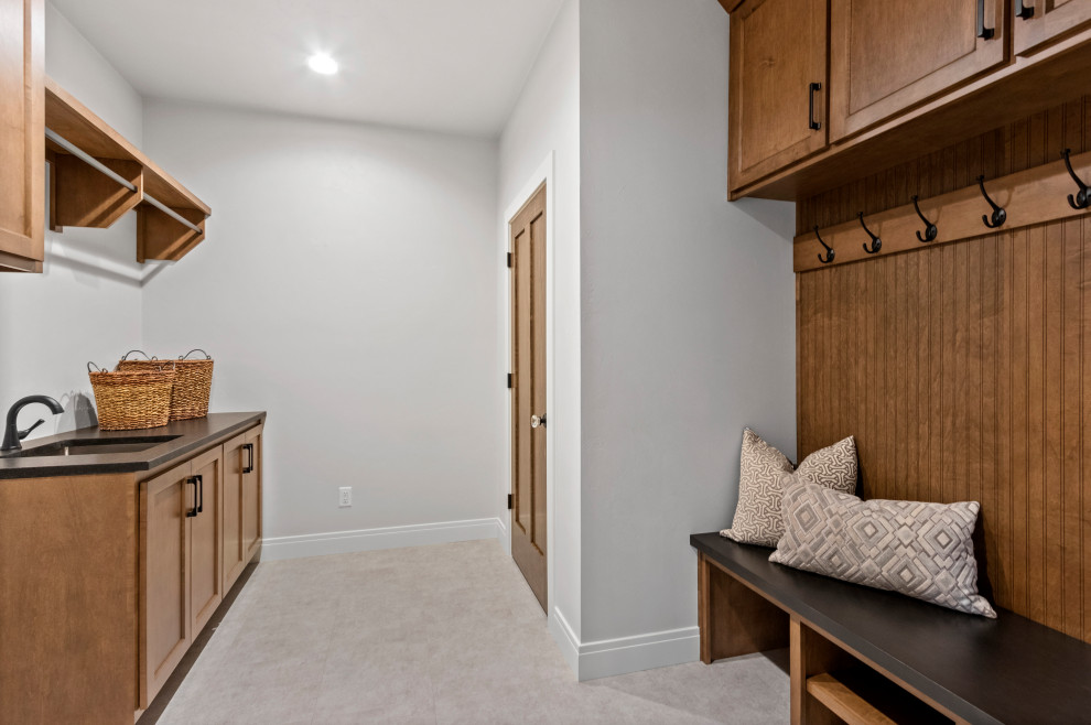 Mid-sized transitional vinyl floor and white floor mudroom photo with white walls