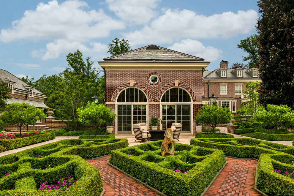 Inspiration for a traditional backyard full sun formal garden for summer in Philadelphia with a garden path and brick pavers.