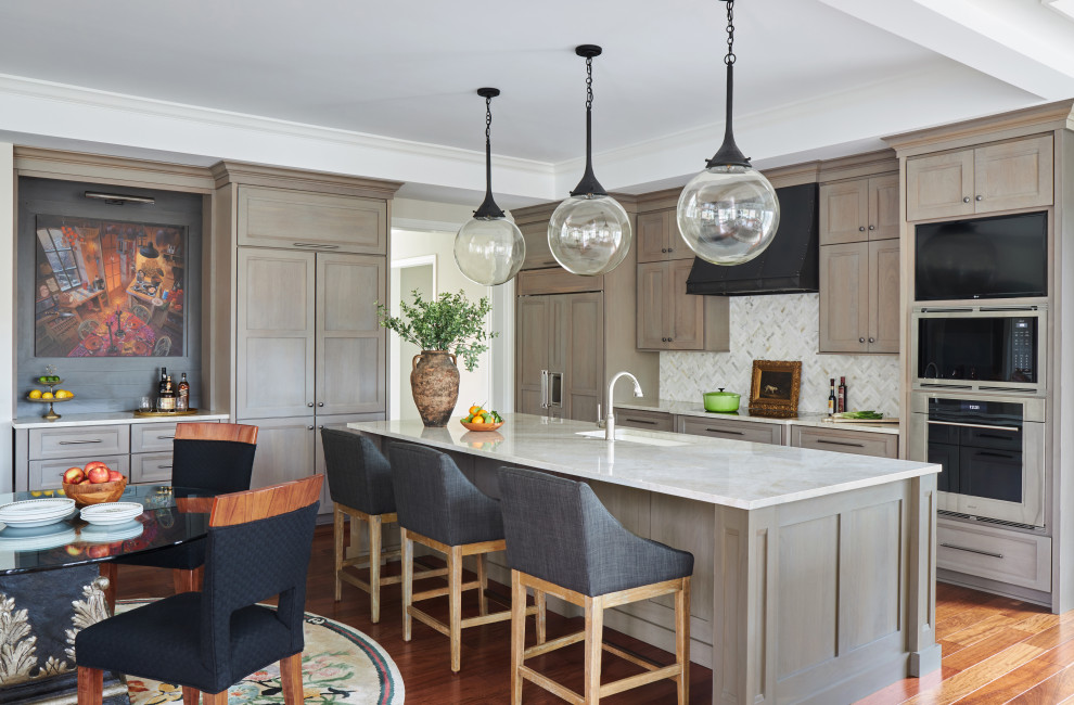 Transitional kitchen photo in Chicago with an undermount sink, flat-panel cabinets, medium tone wood cabinets, quartzite countertops, beige backsplash, stone tile backsplash, paneled appliances, an island and white countertops