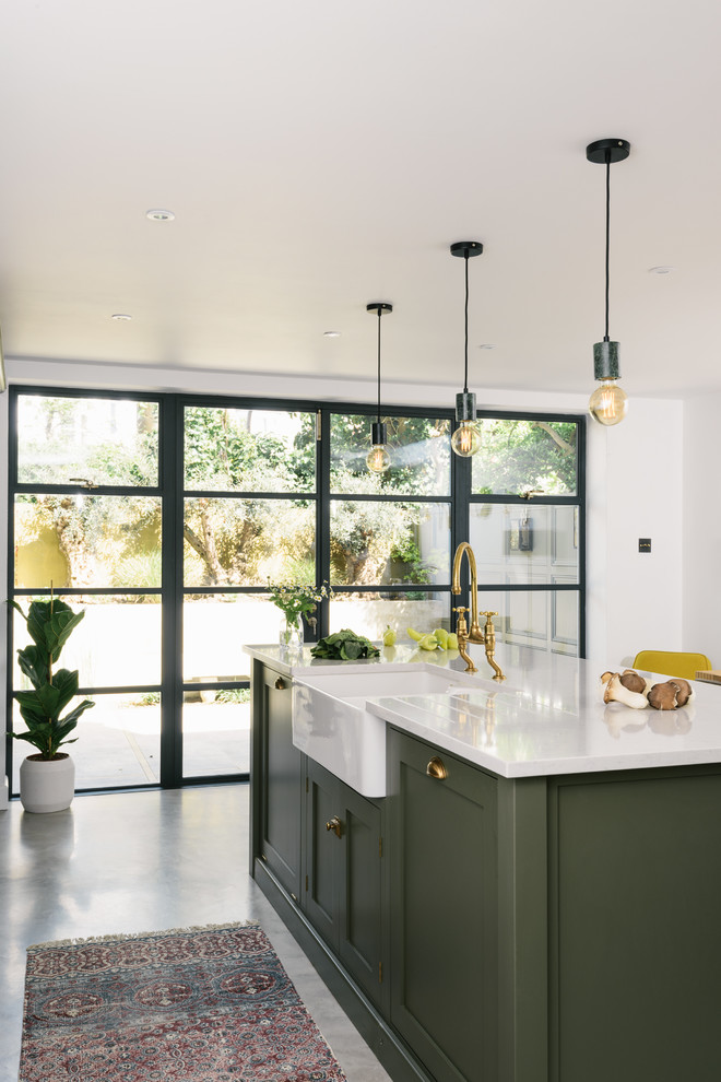 Design ideas for a mid-sized contemporary eat-in kitchen in Other with shaker cabinets, green cabinets, quartzite benchtops, white splashback, panelled appliances, with island and white benchtop.