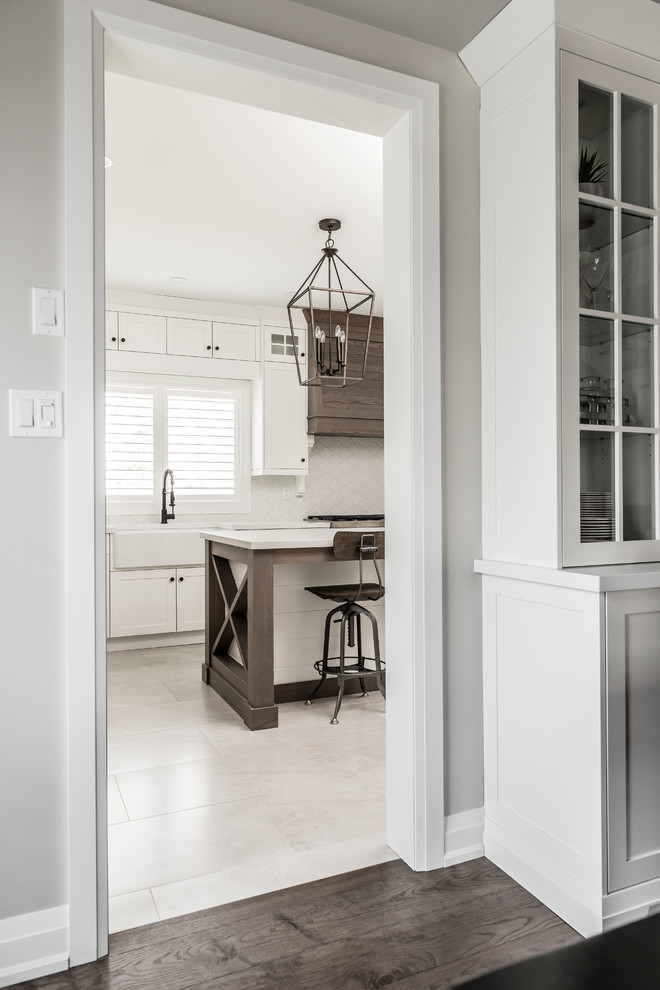 Example of a transitional kitchen design in Toronto