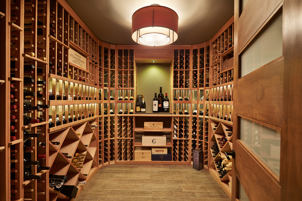 Design ideas for a mid-sized contemporary wine cellar in Seattle with porcelain floors and display racks.