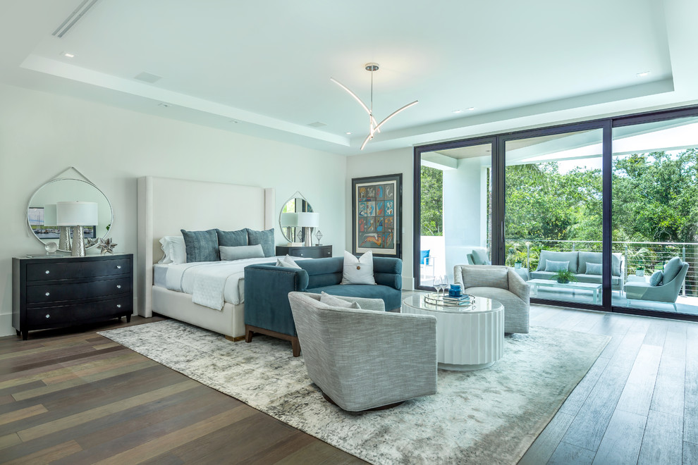 Contemporary bedroom in Miami with grey walls, dark hardwood floors and brown floor.