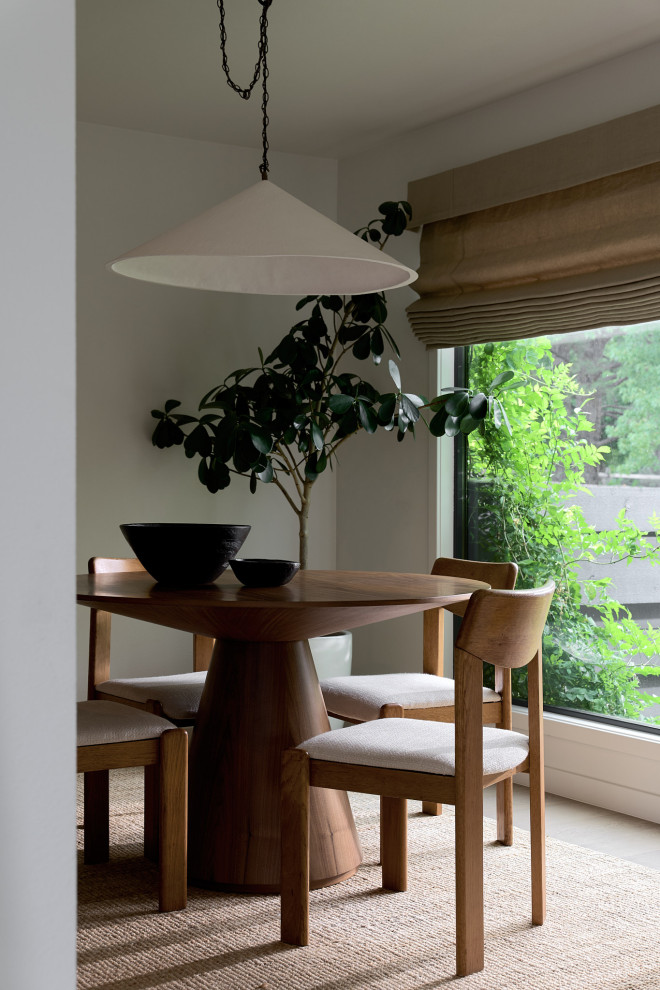 Example of a 1950s dark wood floor and brown floor dining room design in Denver with white walls