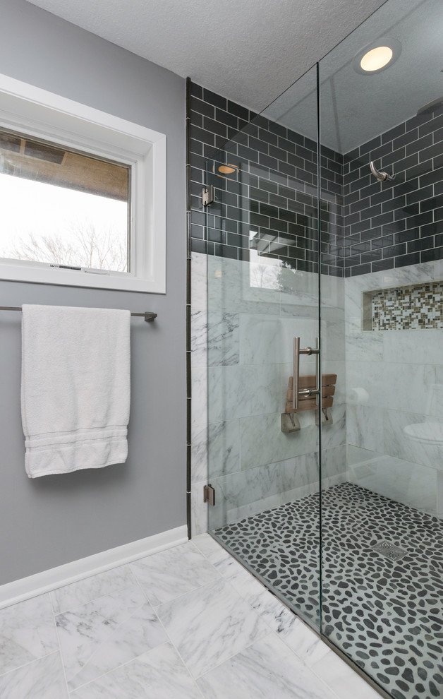 Inspiration for a mid-sized transitional master gray tile and mosaic tile marble floor walk-in shower remodel with an undermount sink, recessed-panel cabinets, dark wood cabinets, quartzite countertops, a one-piece toilet and gray walls