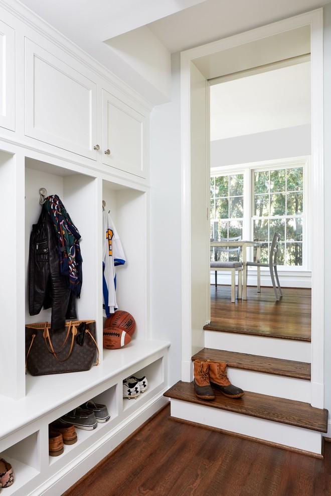 Example of a mid-sized transitional dark wood floor and brown floor mudroom design in DC Metro with gray walls