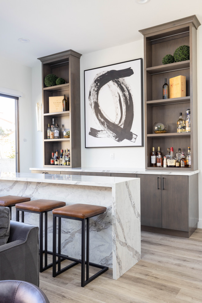 This is an example of a transitional home bar in Orange County.