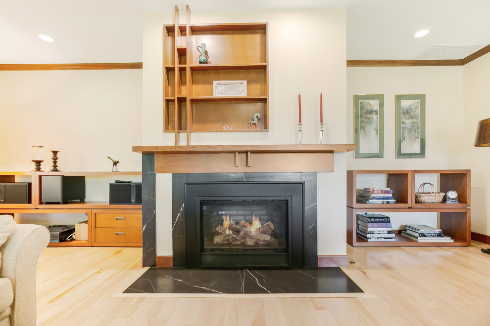 This is an example of a mid-sized scandinavian living room in Portland with a standard fireplace and a tile fireplace surround.