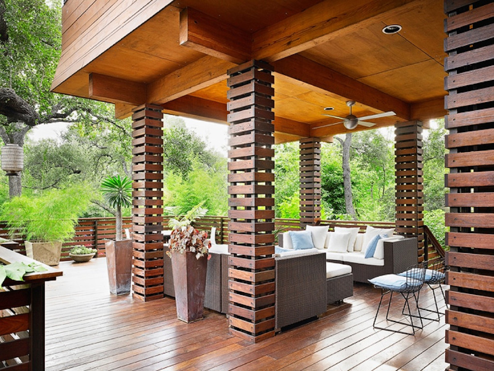 Design ideas for an asian deck in Austin with a roof extension.