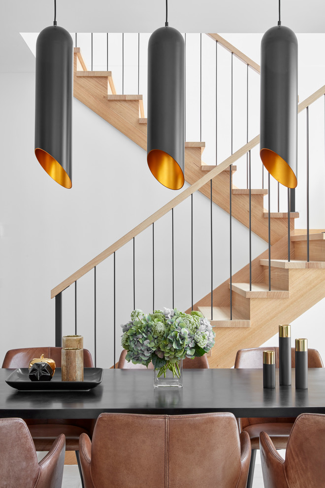 Mid-sized contemporary wood u-shaped staircase in Melbourne with wood risers and wood railing.