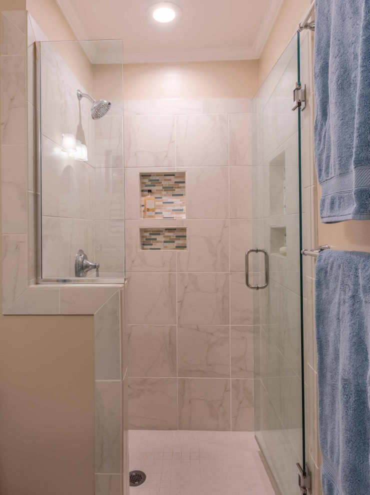 Example of a small transitional master white tile and ceramic tile ceramic tile, white floor and single-sink alcove shower design in Other with flat-panel cabinets, dark wood cabinets, a one-piece toilet, beige walls, an integrated sink, solid surface countertops, a hinged shower door, multicolored countertops, a niche and a built-in vanity