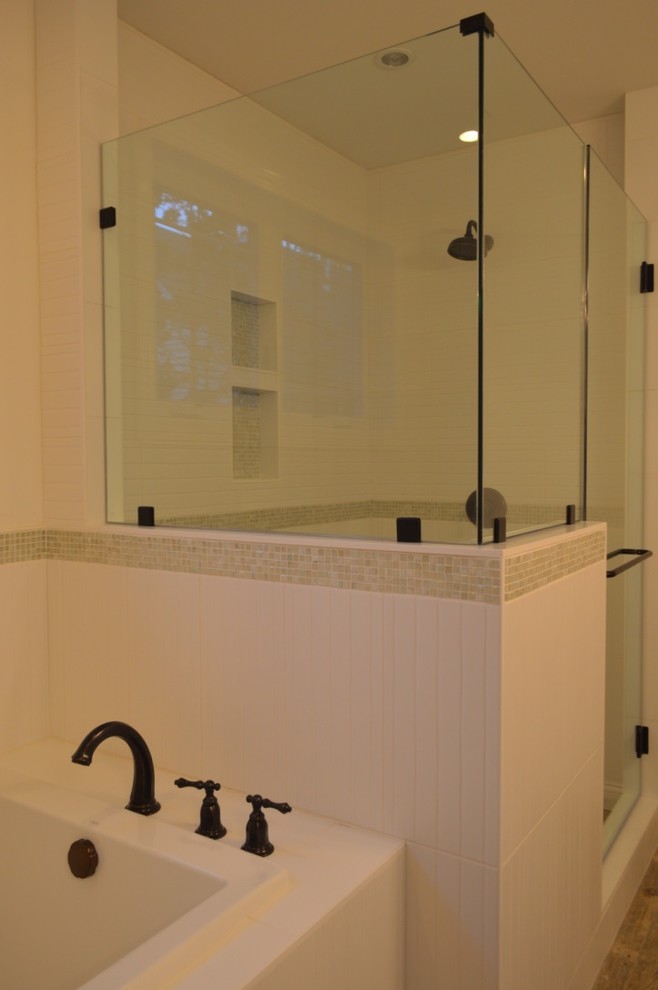 This is an example of a large arts and crafts master bathroom in Detroit with shaker cabinets, white cabinets, a drop-in tub, a corner shower, white tile, mosaic tile, beige walls, medium hardwood floors, a drop-in sink, granite benchtops, brown floor and a shower curtain.